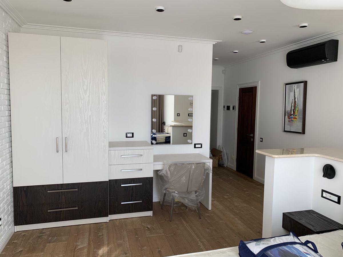 An apartment with a high-end, designer renovation. Move right in!