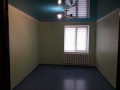 Two-bedroom apartment for sale with a large open-concept kitchen and recent renovations in a brick building