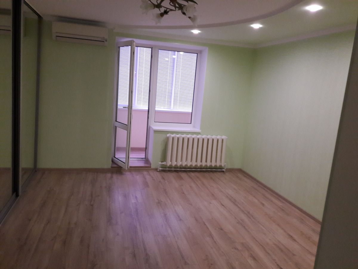 Two-bedroom apartment for sale with a large open-concept kitchen and recent renovations in a brick building
