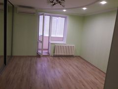 Two-bedroom apartment for sale with a large open-concept kitchen and recent renovations in a brick building