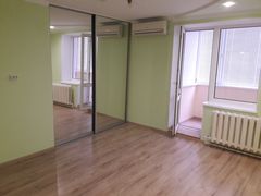 Two-bedroom apartment for sale with a large open-concept kitchen and recent renovations in a brick building