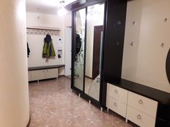 Two-bedroom apartment for sale with a large open-concept kitchen and recent renovations in a brick building
