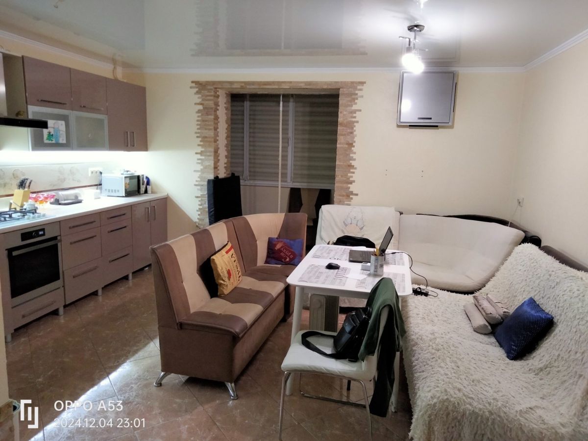 Two-bedroom apartment for sale with a large open-concept kitchen and recent renovations in a brick building