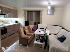 Two-bedroom apartment for sale with a large open-concept kitchen and recent renovations in a brick building