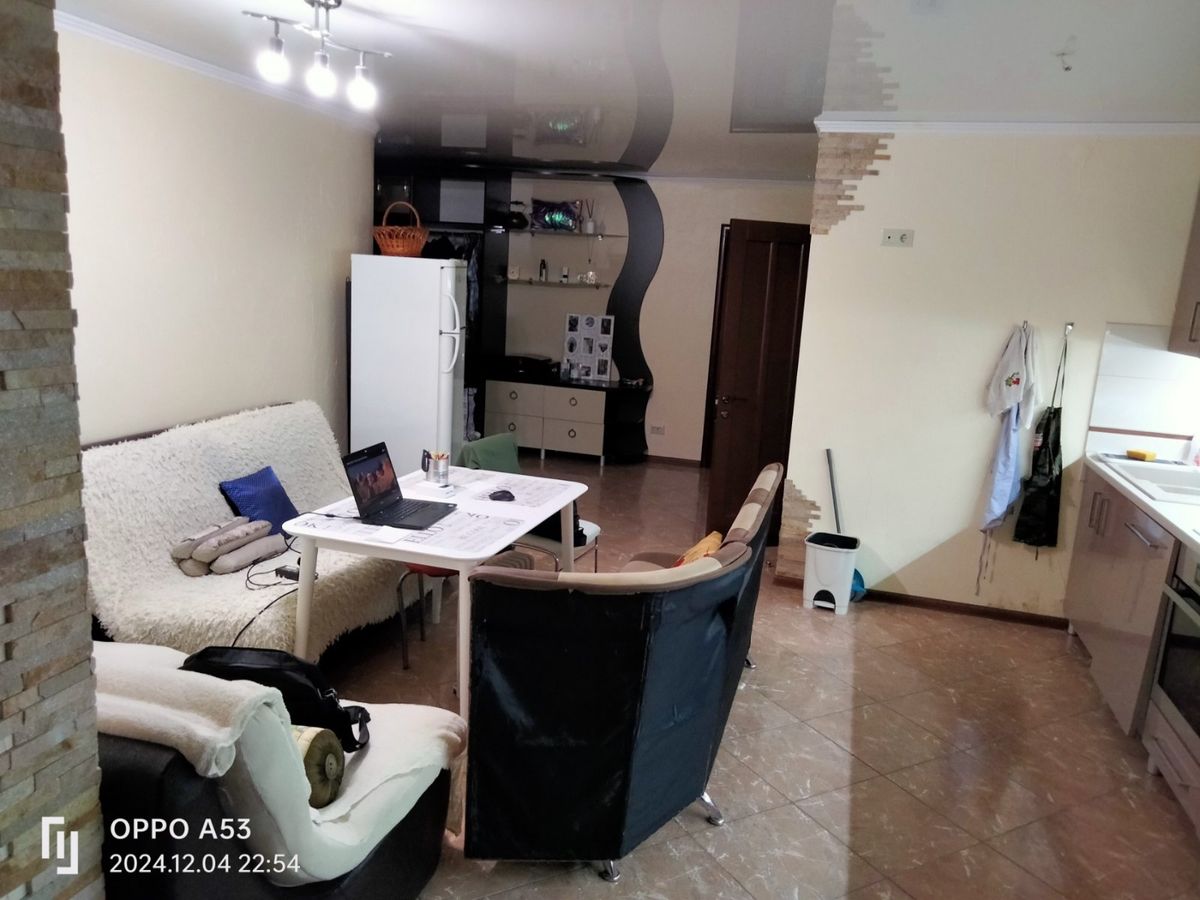 Two-bedroom apartment for sale with a large open-concept kitchen and recent renovations in a brick building