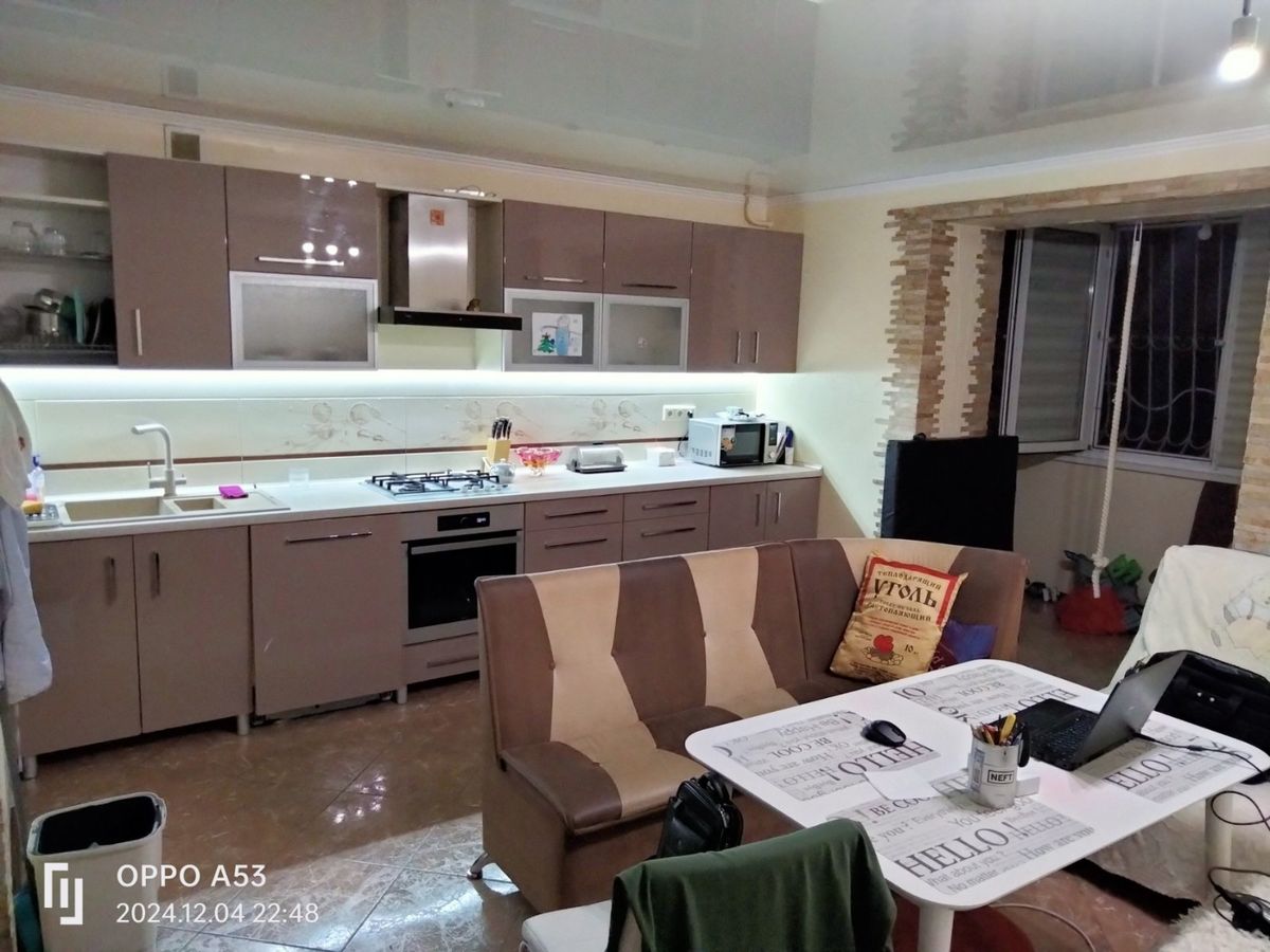 Two-bedroom apartment for sale with a large open-concept kitchen and recent renovations in a brick building