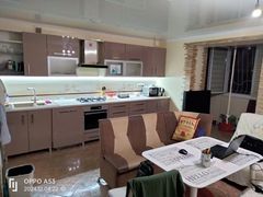 Two-bedroom apartment for sale with a large open-concept kitchen and recent renovations in a brick building