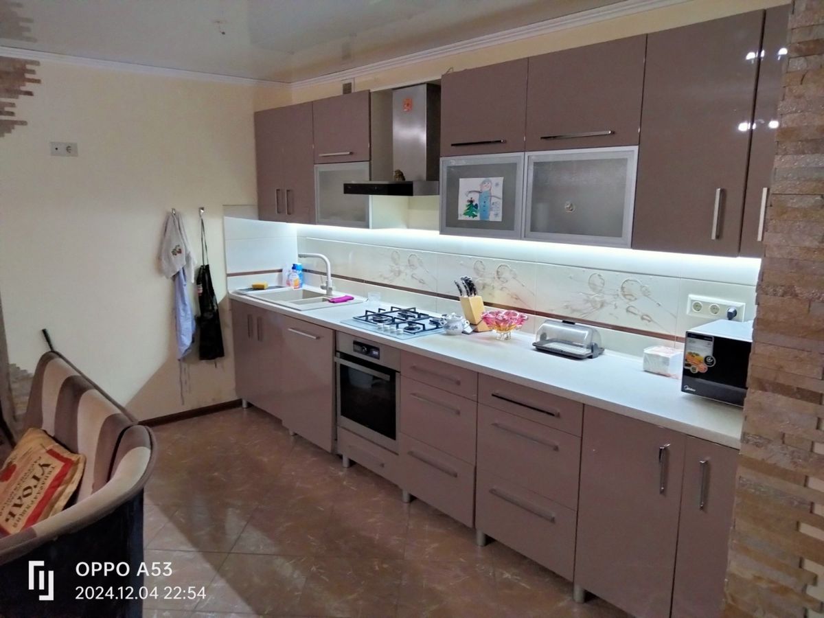 Two-bedroom apartment for sale with a large open-concept kitchen and recent renovations in a brick building
